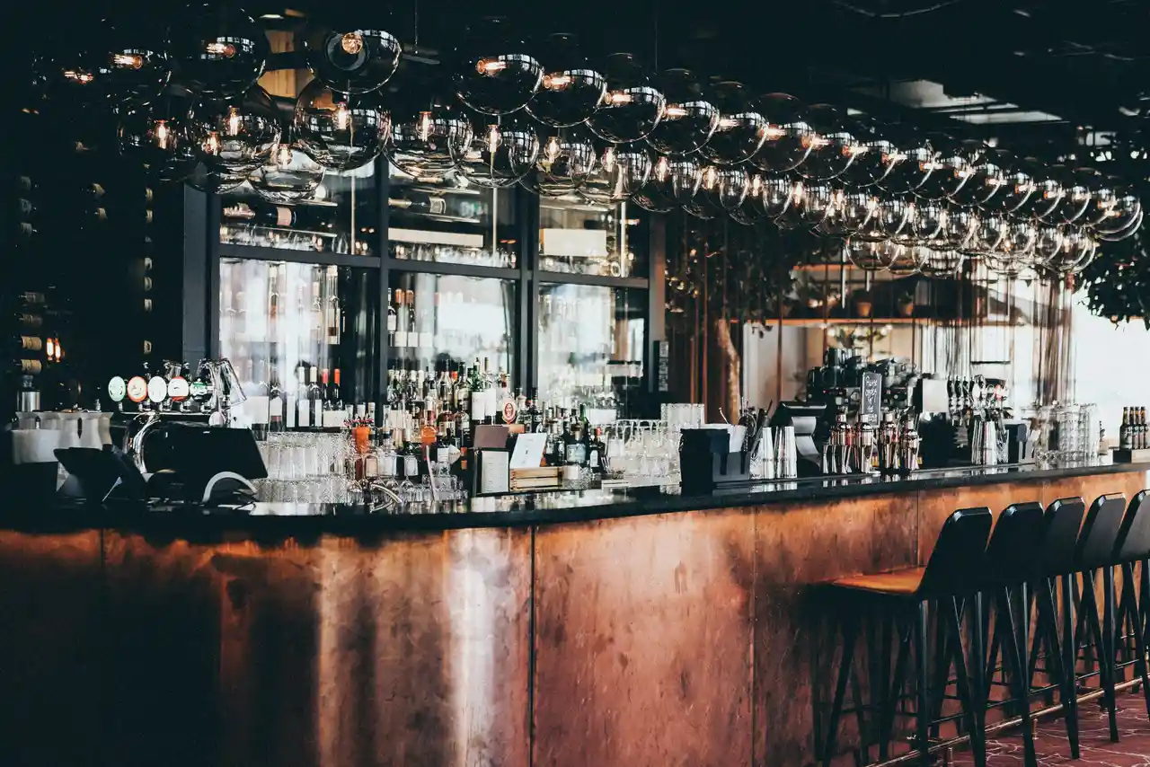 Empty, stylish pub or tavern with copper front and glass lights