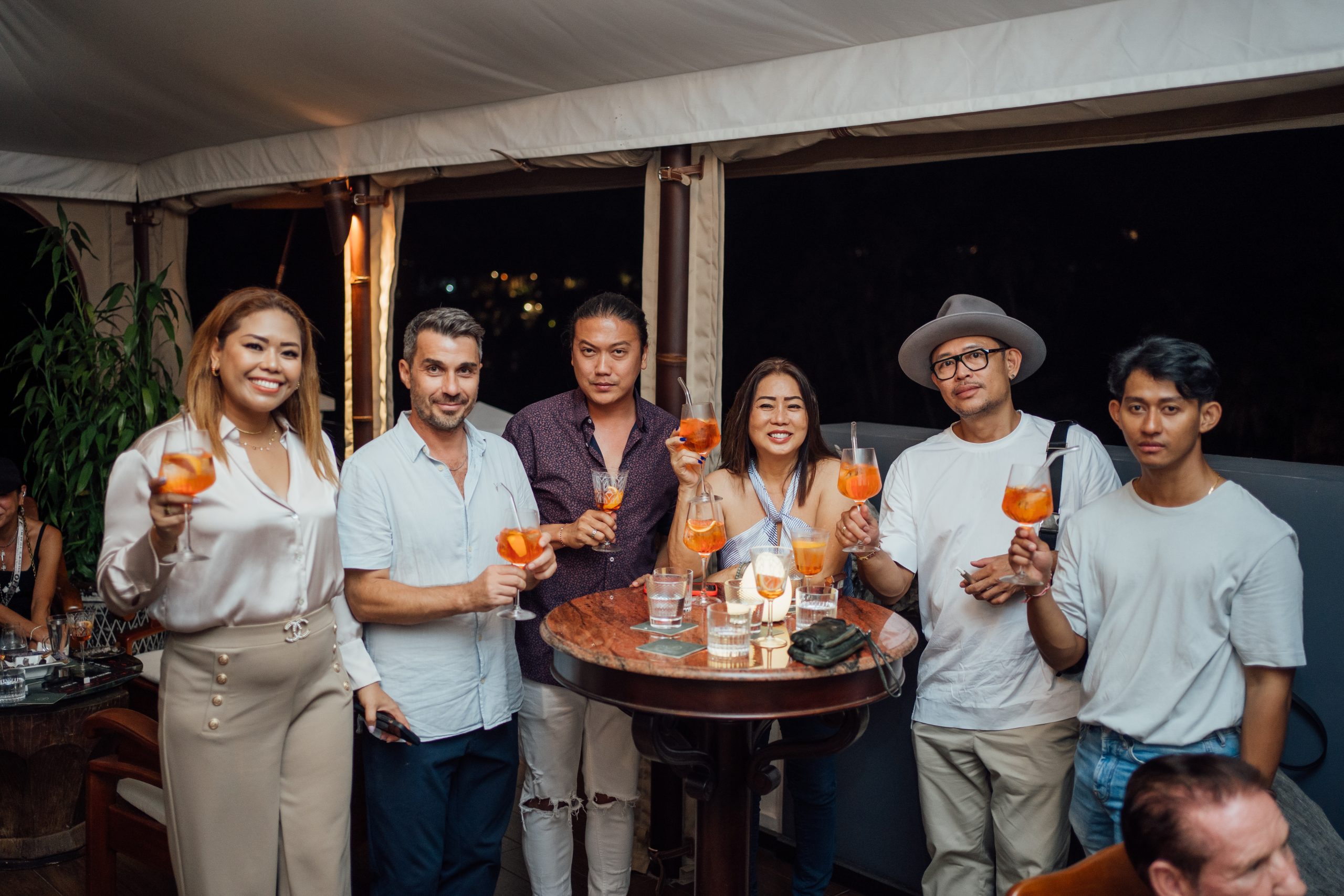 Guests at a rooftop bar in Ubud with drinks