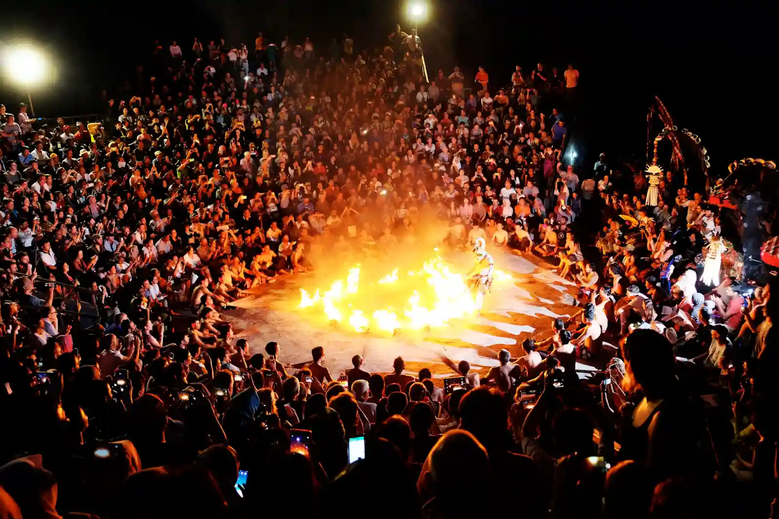 A large crowd watches a Balinese Kecak fire dance