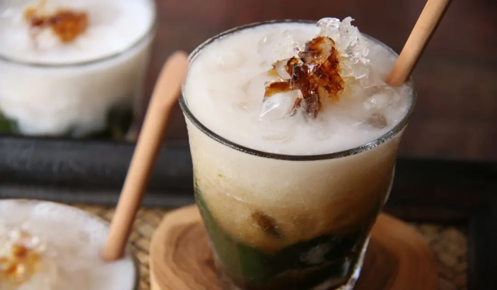 Green grass jelly drink with coconut milk syrup