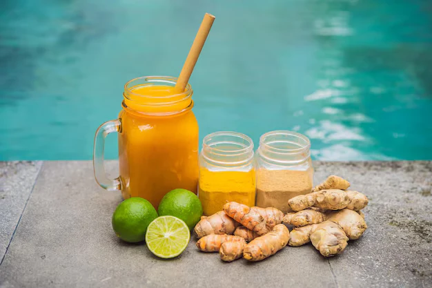 Turmeric ginger herbal drink with fresh lime ingredients
