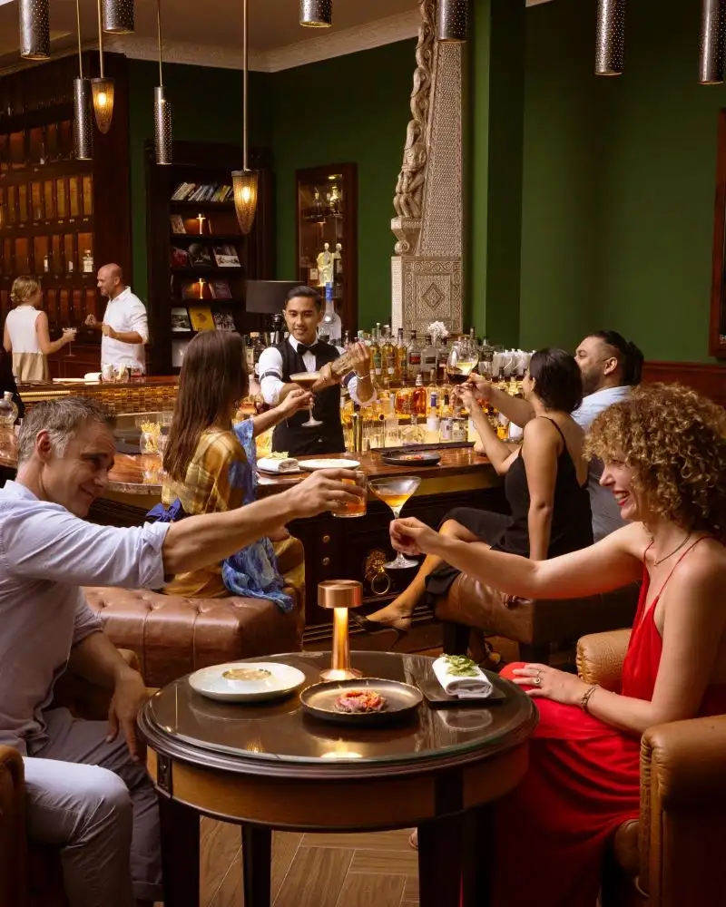 People enjoying cocktails at a luxury bar