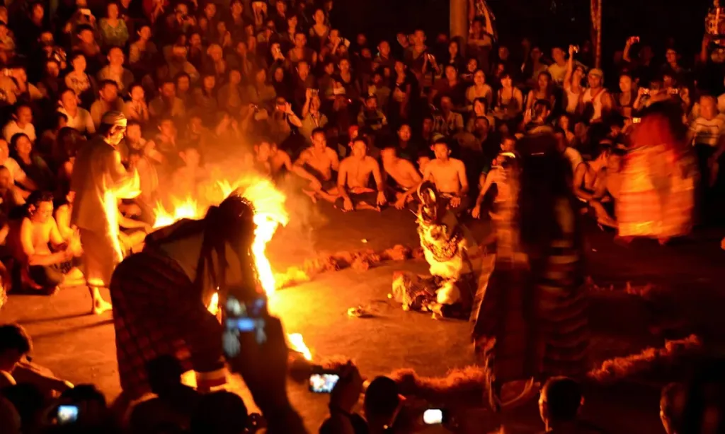 Traditional Balinese fire dance performance at night