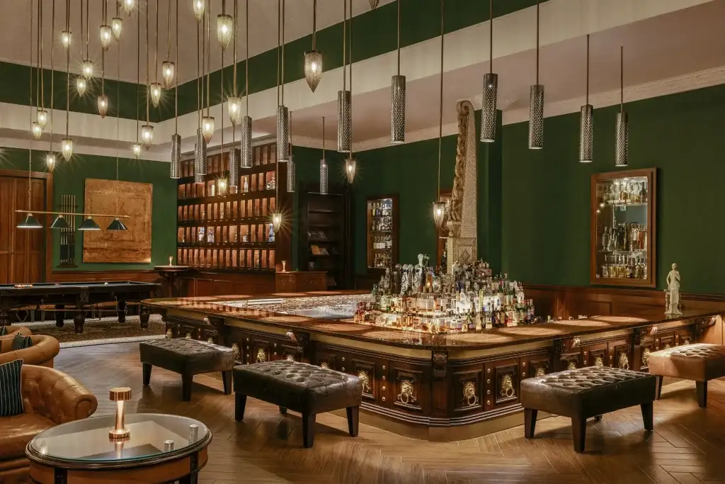 Elegant interior of the green-walled Pinstripe Bar