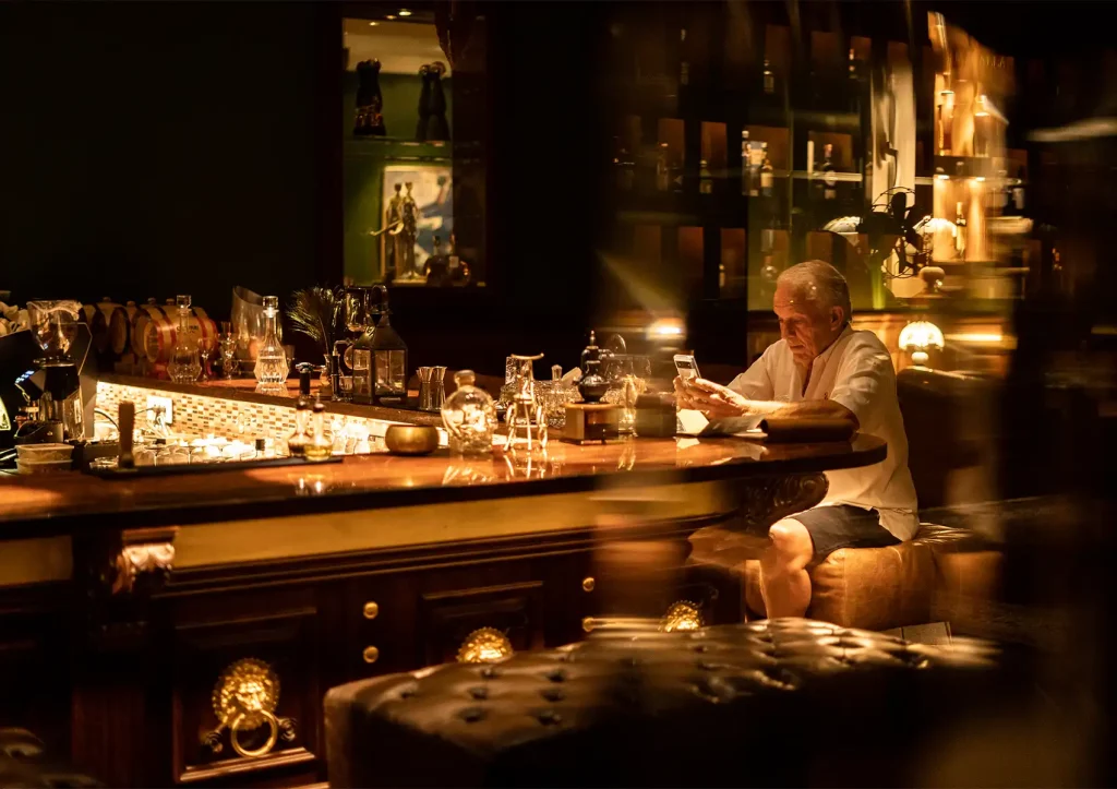 ubud nightlife with guest enjoying drinks in cozy bar with warm golden lighting